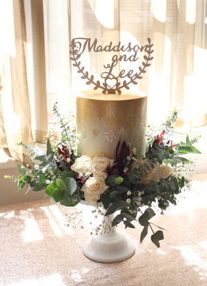 Ivory and burnished gold accents Weddingcake with fresh flower wreath and wooden topper
