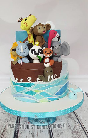 Noahs ark cake  ark cake  animal cake  animal cake toppers  chocolate biscuit cake  flamingo  panda  lion  giraffe  rat  fox  monkey  elephant  rhino  christening cake   %287%29