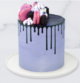 The Purple, Macaron & Silver Cake is a buttercream iced cake. The single tier is 6″ deep and 2 tier options are 10″ deep. This cake includes macarons, blackberries, mini meringues, edible cornflowers and silver leaf. The berries may vary due to availability. A name plaque can be added to the front of the cake.