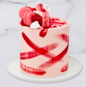 The “Painted Raspberry Pink Cake is a buttercream iced cake. The single tier is 6″ deep and 2 tier options are 10” deep. This cake also includes macarons, raspberries, raspberry powder and mini meringues. A name plaque can be added to the front of the cake.