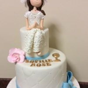 First Communion Cakes with Hand Made Models to represent the child in question.