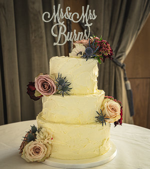 Rustic textured buttercream and fresh flowers