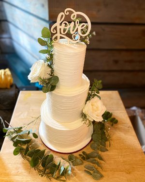 3 tier rustic, white, minimalist modern wedding cake with fresh flowers